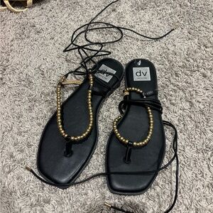 DV by Dolce Vita Black Sandals with Gold Beaded T-Strap and Lace-Up Ankle Ties